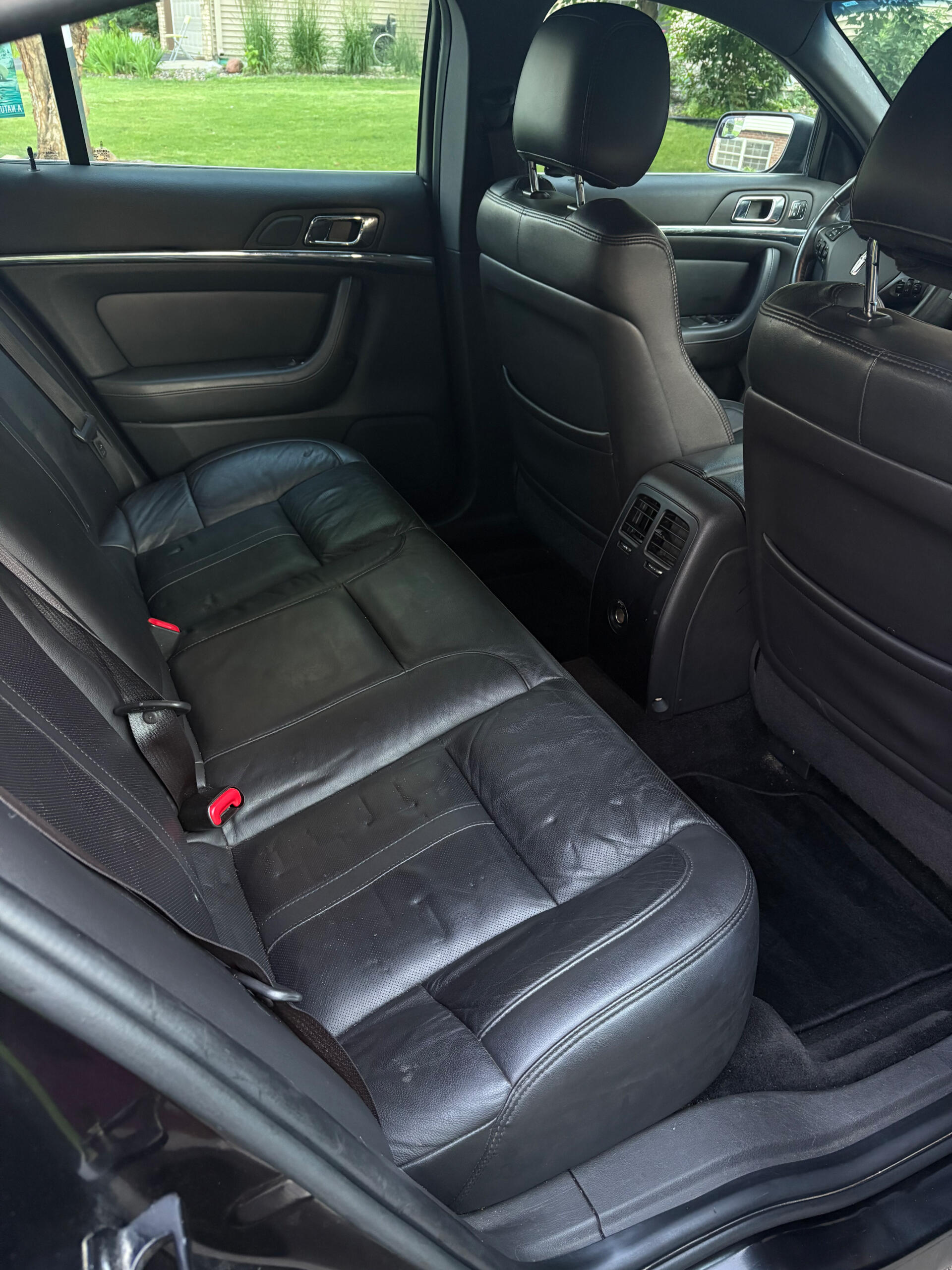 A clean leather back seat that has been mobile detailed by Four Seasons Detailing team in Lino Lakes, MN.